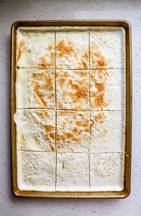 Top down view of a sheet pan of egg whites cut into 12 squares. Egg White Sheet Pan, Egg Whites In Oven, Egg White Sheet Pan Eggs, How To Use Egg Whites, Baked Egg Whites In Oven, Sheet Pan Egg Whites, Egg White Recipes Breakfast, Baked Egg Whites, Egg White Bake