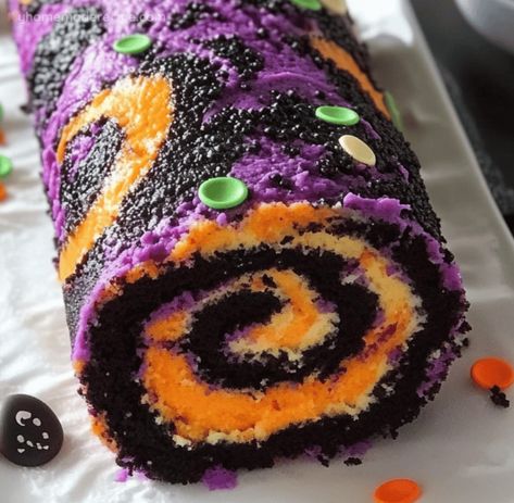 Halloween Cake Roll: Spooky And Delicious! Halloween Cake Roll Recipes, Patterned Cake Roll Recipes, Halloween Swiss Roll Cake, Pumpkin Sponge Cake Roll, Purple Halloween Birthday Cake, Batter Mix, Frosting Colors, Orange Food Coloring, Halloween Sprinkles