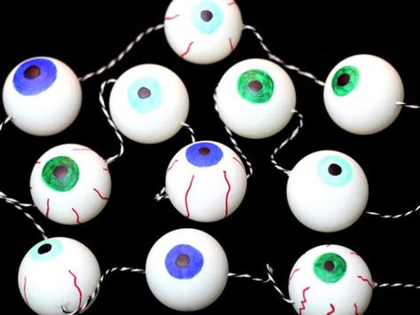 This eyeball garland is a fun, inexpensive way to decorate for Halloween. Eyeball Garland, Decorate For Halloween, Halloween Eyeballs, Decorating On A Budget, Diy Holiday, Holiday Crafts, Novelty Christmas, Christmas Ornaments, Holiday Decor