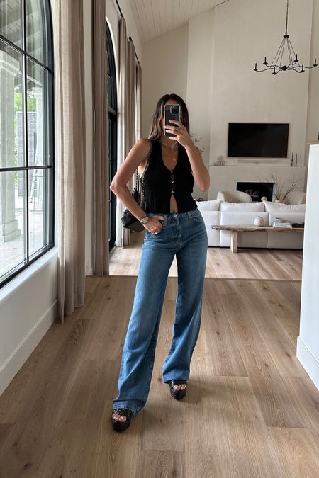 Wedged Sandals Outfits, Black Shirt Denim Jeans Outfit, Bootcut Jeans And Sandals Outfit, Baggy Jeans Outfit With Sandals, Black Top And Denim Jeans Outfit, Black Tank Jeans Outfit, Black Vest Shirt Outfit, Baggy Jeans And Sandals Outfit, Jean And Sandal Outfits