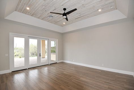 Custom Master Bedroom in Bella Luna | Bordeaux Builders Tray Ceiling With Wood Planks, Trayed Ceiling Ideas Bedroom, Master Tray Ceiling, Tray Ceiling Wood Planks, Wood In Tray Ceiling, Tray Bedroom Ceiling, Wood Tray Ceiling Bedroom, Custom Ceiling Ideas, Plank Ceiling Bedroom