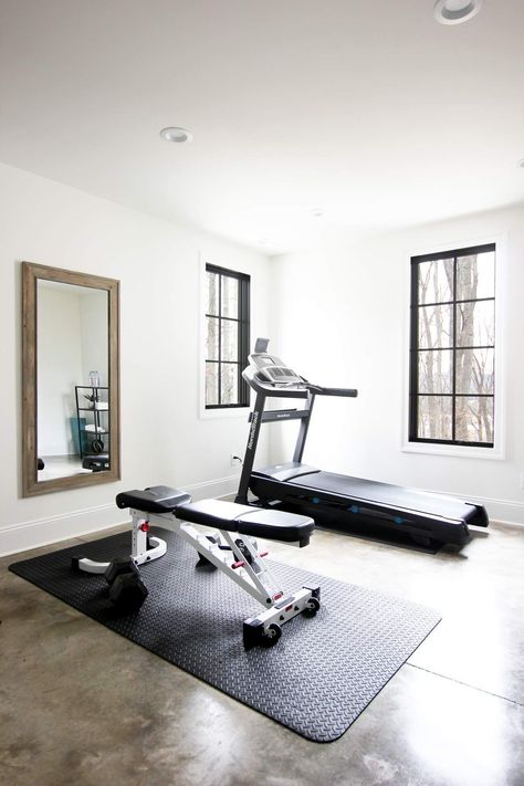 Here are some tips for setting up your own home gym! #basement #basementgym #homegym #concretefloors #blackwindows Outside The House Ideas, Treadmill Home Gym, Small Gym Layout, Turn Garage Into Gym, House Gym Ideas Small Spaces, At Home Gym Ideas Garage, House Gym Room, Gym In Home, Home Gym And Office Combo