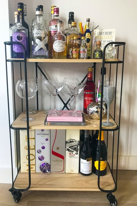 Check out how we styled a bar cart on a budget. Including bar cart ideas and bar cart styling. Drinks Trolley Styling, Bar Trolley Styling, Swanky Bar, Trolley Ideas, Decorate Cubicle At Work, Space Saving Ideas For Home, Bar Cart Ideas, Cocktail Trolley, Home Bar Rooms