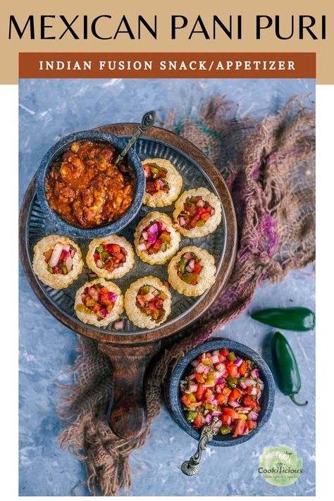 Pani puri recipe gets a Mexican Indian fusion makeover! Here, the puris are filled with Mexican food - beans & salsa to give this vegan Asian snack a whole new flavor! Makes for a crunchy, tasty snack that's loved by all! #panipuri #Mexican #Indian #fusion #vegan #snack #streetfood #howtomake #salsa #beans #plantbased #appetizer Mexican Pani Puri, Indian Fusion Food, Chat Recipes, Pani Puri Recipe, Mexican Fusion, Homemade Jerky, Puri Recipe, Puri Recipes, Indian Appetizers