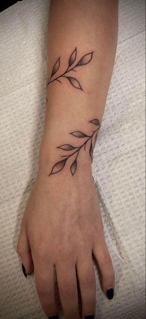 A list featuring all kinds of wrist tattoos to inspire your personal design. Vine Patchwork Tattoo, Leaf Wrap Around Tattoo Arm, Wraparound Tattoo, Arm Wrap Tattoo, Around Arm Tattoo, Wrap Around Tattoo, Wrist Tattoo Ideas, Vine Tattoo, Wrap Tattoo