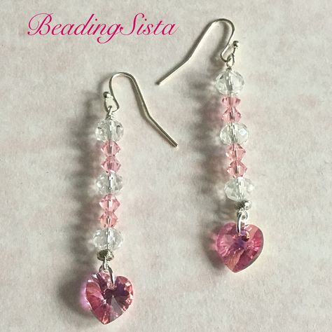 ~ This beautiful Swarovski crystal heart. I think these earrings are so delicate and dainty.  ~ This is a pair of romantic pink heart Swarovski crystal dangle earrings that is part of my Heart collection! This pink sparkly Swarovski crystal heart is a beautiful color! There is 4mm rose pink ab Swarovski crystal above the heart crystal along with a 6mm Crystals.  ~ Comes in a gift box. Pink Heart Crystal, Anting Manik, Diy Jewelry Earrings, Crystal Heart Earrings, Swarovski Crystal Hearts, Valentines Earrings, Diy Jewelry Unique, Swarovski Crystal Jewelry, Pink Sparkly