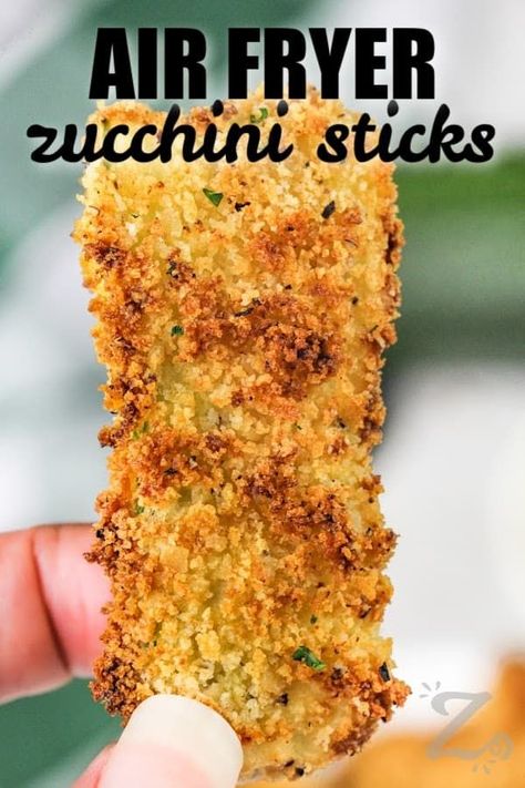 For healthy snacking full of flavor and crunch, try this easy recipe for air fryer zucchini sticks. Fresh zucchini squash are cut into sticks or sliced into thick chips. Then they get breaded with panko or your favorite seasoned bread crumbs, a spritz of cooking oil, and roasted in the air fryer until tender on the inside and crunchy on the outside! #airfryerzucchinisticks #zucchiniintheairfryer #ourzestylife #airfryerzucchinisticksketo Air Fryer Zucchini Slices, Air Fryer Zucchini Spears, Fried Zucchini Slices, Breaded Zucchini Air Fryer, Fried Zucchini Recipe Air Fryer, Zucchini Sticks Air Fryer, Zucchini Breaded, Zucchini In The Air Fryer, Breaded Zucchini