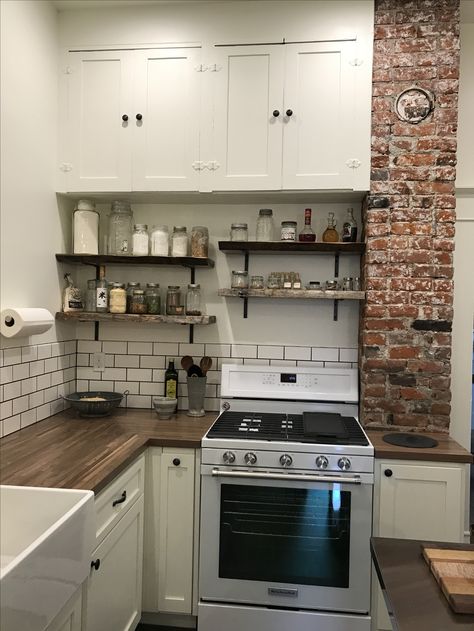 Old house kitchen remodel with blue pine, raw edge shelves, exposed brick chimney and butcher block counters. Mirror image of my corner - no cabinets up top Small Kitchen With Chimney, Kitchen With Exposed Brick Chimney, Small Chimney Ideas, Old Chimney In Kitchen, Exposed Chimney In Kitchen, Exposed Brick Chimney In Kitchen, Chimney In Kitchen, Old House Kitchen Remodel, Raw Edge Shelves