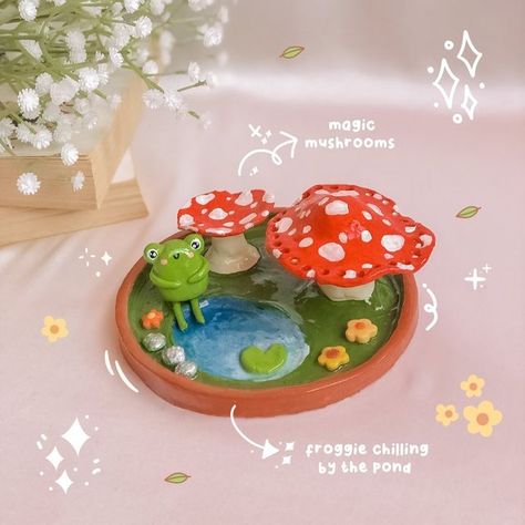 Sisters & Brushes ✦ Handmade Clay Creations on Instagram: "Oh, hello again!! Just keeping the froggie content coming! Here’s another froggie trinket dish to help brighten up your day ꒰♡꒱ Fun fact: the tiny holes around the big mushroom is there to hold your earrings safely and the smol one you can put your rings and necklaces on top! 🙈 functionality meets creativity ✨✨ Anywayyy thank uuu for all the LUVVV 😮‍💨❤️ u guys are awesome! What do you want to see next from Sisters & Brushes? 🫣 • • • Clay Mushroom Trinket Dish, Cute Clay Plate Ideas, Frog Trinket Dish, Ring Dish Clay, Cute Trinket Dish, Clay Trinkets, Big Mushroom, Clay Tray, Diy Dish