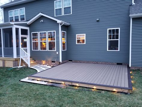 Diy ground level composite deck. Led lighting. Stone border Pool Surround, Small Backyard Decks, Ground Level Deck, Deck Diy, Landscaping Projects, Deck Backyard, Floating Deck, Patio Deck Designs, Composite Deck