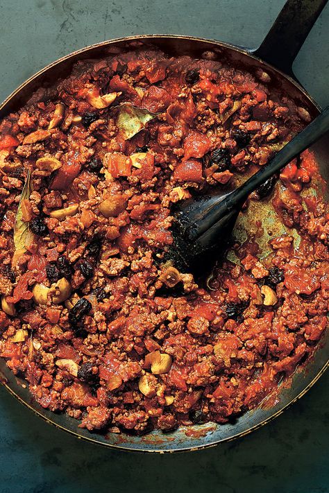 Picadillo is one of the great dishes of the Cuban diaspora: a soft, fragrant stew of ground beef and tomatoes, with raisins added for sweetness and olives for salt Versions of it exist across the Caribbean and into Latin America This one combines ground beef with intensely seasoned dried Spanish chorizo in a sofrito of onions, garlic and tomatoes, and scents it with red-wine vinegar, cinnamon and cumin, along with bay leaves and pinches of ground cloves and nutmeg Ground Beef And Tomatoes, Creamed Greens, Potpie Recipe, Picadillo Recipe, Cuban Cuisine, Nyt Cooking, Cuban Recipes, Most Popular Recipes, Popular Recipes