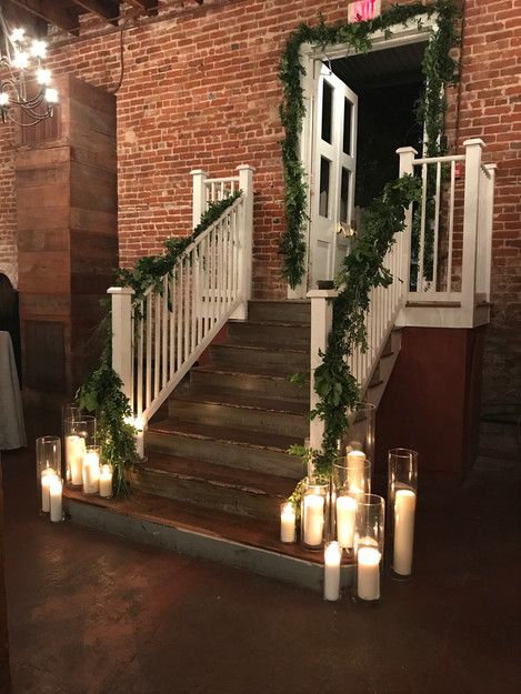 Wolff Ballroom, Washington, Louisiana: wedding reception decor. Pillar candles arranged at bottom of staircase, candle entrance, candle backdrop Staircase Candles, Candles Stairs, Candles Up Stairs Wedding, Candles On Stairs Wedding, Candles On Steps Wedding Stairs, Candle Stairs, Candle Lit Wedding Ceremony Indoor, Candle Backdrop, Candle Alter