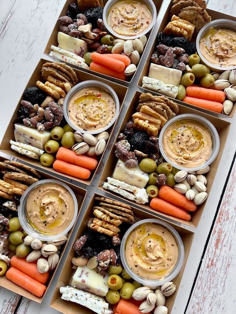 Individual Charcuterie Boxes (also known as grazing boxes) are loaded with sweet and savory treats that make great gifts for any occasion. Fill your grazing box with a variety of nuts, cheeses, fruits and chocolate, and watch the smiles appear! Packaged Food Ideas, Charcuterie Snack Pack, Traveling Charcuterie Board, Personal Charcuterie Box Ideas, Charcuterie Lunch Box Ideas, Food To Sell Ideas Make Money, Brunch Box Breakfast, Charcuterie Store, Charcuterie Boxes To Go