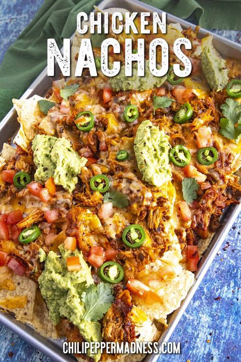 These are the best chicken nachos loaded with juicy, saucy shredded chicken, melty cheese and salsa con queso for extra cheesiness, and all the toppings! Chicken Cheese Nachos, Nachos With Chicken And Cheese, Best Chicken Nachos Recipe, Chicken For Nachos, Mexican Chicken Nachos, Creamy Chicken Nachos, Mexican Nachos Recipe, Shredded Chicken Nachos, Nacho Chicken