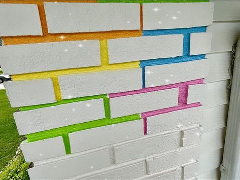 Colourful & Maximalist Home Decor Inspo | It took a half dozen trips to the paint store, but I think we’re ready to splash up the neighborhood 🌈 | Facebook Painted Brick Wall, Maximalist Home Decor, Paint Store, Maximalist Home, Storing Paint, Painted Brick, Garden Pool, The Neighborhood, New Builds