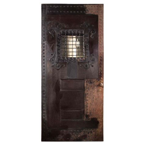 C. 1900 Arts and Crafts style oak and cast iron two panel door with nailhead detail. "Speakeasy" style window has iron grill with scrolling strapwork ornament and opens from the inside. The back side is all oak. Provenance: A Pennsylvania mansion Two Panel Door, Basement Speakeasy, Speakeasy Door, Speakeasy Style, Two Panel Doors, Arch Doors, Windows Shutters, Iron Grill, 1920s Party