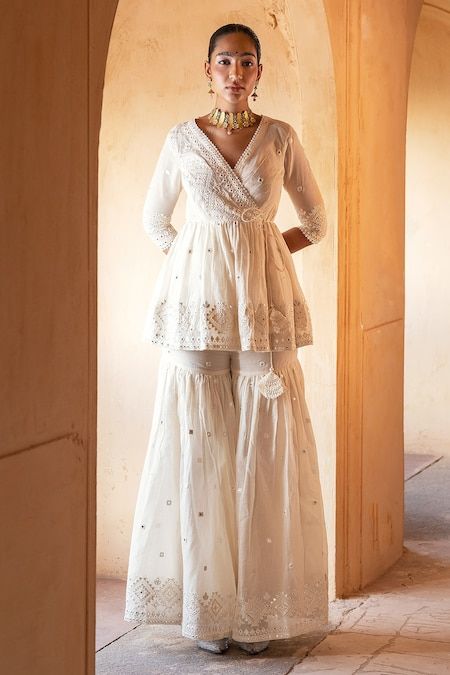 Buy Off White Peplum Top Cotton Mulmul Embroidery Angrakha And Sharara Set For Women by PREEVIN Online at Aza Fashions. Sharara Designs Simple, Peplum Top Outfits Indian, Trendy Ethnic Outfits, Garara Dress, White Sharara, White Peplum Top, Work Photos, Sharara Designs, Off White Fashion