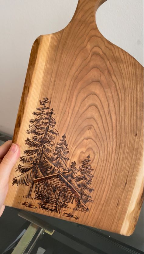 Wood Burned Mountain Scene, Wood Burning Bread Board, Charcuterie Board Burn Design, Wood Burning Memorial Ideas, Burned Wood Design, Rustic Wood Burning Ideas, Woodburned Charcuterie Board, Mountains Wood Burning, Forest Wood Burning