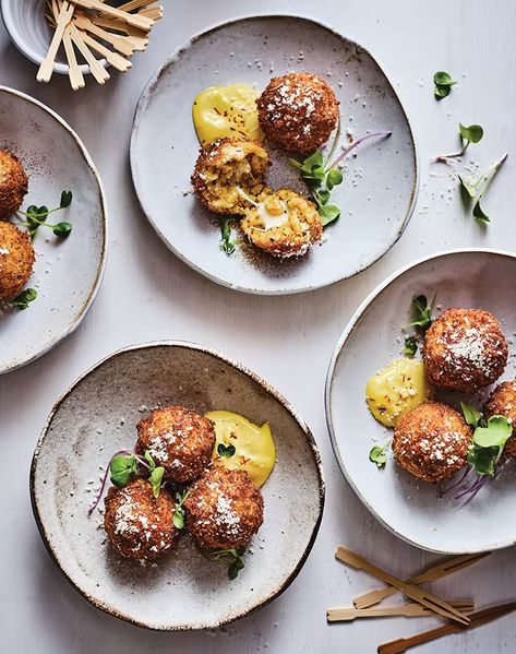 Aloo Tikki Arancini with Saffron Aioli Recipe - PureWow Fancy Easy Appetizers, Fancy Starters, Saffron Aioli, Fried Potato Patties, Gastronomic Food, Summer Appetizers, Blue Rocks, Aloo Tikki, New Year's Eve Appetizers