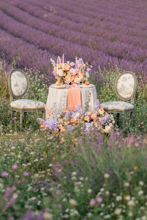 French pastel sweetheart table in Provence lavender field reception #lavenderfieldwedding #ProvenceLavenderFields #pastelreception #FrenchWedding Field Reception, Pastel Reception, Lavender Field Wedding, French Table Setting, French Lavender Fields, Outdoor Editorial, French Pastel, Dreamy Cottagecore, Purple Boutonniere