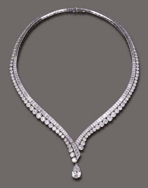 AN ELEGANT DIAMOND NECKLACE, BY VAN CLEEF & ARPELS  The flexible V-shaped baguette-cut diamond line, enhanced by graduated circular-cut diamond trim, the front suspending a detachable pear-shaped diamond, weighing approximately 4.11 carats, mounted in platinum and 18k gold, 16 ins., with French assay marks and maker's mark, in a Van Cleef & Arpels blue suede envelope case Van Cleef Arpels Blue, Elegant Diamond Necklace, Diamond Necklace Simple, Diamond Necklace Designs, Simple Diamonds, Solitaire Pendant Necklace, Diamond Jewelry Necklace, Party Necklace, Van Cleef Arpels