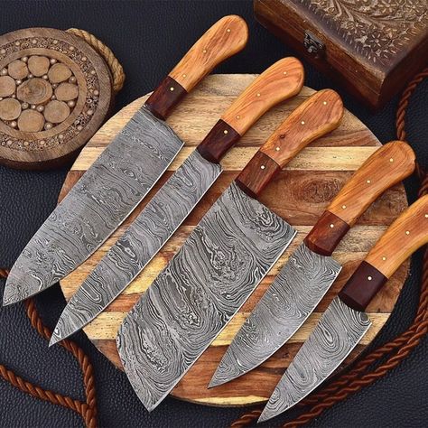 Handmade Damascus Steel Knives set for Kitchen, Chef Knives SetsIntroducing the ultimate kitchen companion for every cooking enthusiast, the Custom Handmade Damascus Steel Knives set for Kitchen. Crafted to perfection by skilled artisans, these knives are designed to provide reliability, sharpness, durability, and quality.Imagine the joy of effortlessly slicing through meat, vegetables, and fruits with precision and ease. Each knife is expertly forged with Damascus steel, resulting in a stunning and unique wavy pattern on the blade. The razor-sharp edge ensures that your ingredients are cut cleanly and evenly, making cooking a breeze.The set includes 5 different sized knives, catering to all your culinary needs. From the Chef's knife to the paring knife, every blade is carefully designed t Damascus Kitchen Knives, Damascus Chef Knives, Chef Knives, Knife Gifts, Cleaver Knife, Chef Knife Set, Damascus Steel Knife, Kitchen Ware, Leather Roll