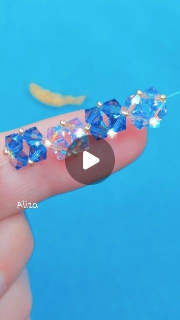 it's queen Aliza on Instagram: "Beautiful bicone beads bracelet tutorial for beginners 🥰  Nylon thread  Bicone beads Golden beads Lobster hook   #beadtutorial #beadedbracelet #seedbead #seedbeadbracelet #handmadejewelry #beads #beadsjewelry #beadsbracelet#kundanjewellery #jewellery #indianjewellery #earrings #bridaljewellery #polkijewellery #necklace #weddingjewellery #kundan #jewelry #kundannecklace #fashion #traditionaljewellery #indianwedding #diycrafts #smallbusiness #diypearlearrings #fabricearrings #easydiy #diyideas" Bicone Beads Bracelet, Diy Pearl Earrings, Beaded Bracelet Diy, Kundan Jewelry, Golden Beads, Beaded Bracelets Tutorial, Fabric Earrings, Polki Jewellery, Kundan Necklaces