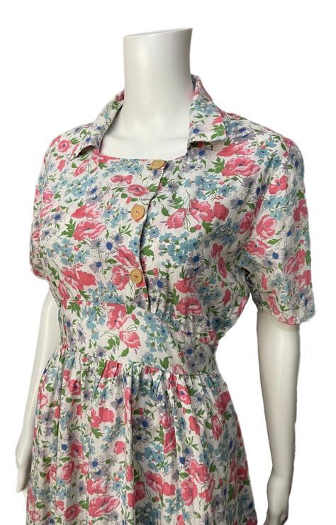 "This is a pretty dress dating from the 1940's. It has a lovely floral print, buttons on the front and side ties. The CC41 label is visible on the neckline, though part of it is missing.  It's in good overall condition. There is a small repair on the front hemline and a small area of colour run from button thread on the front. The cotton is quite crisp and it's possibly been starched at some point)  It's a lovely example from this period with a very pretty print. Bust 36\" Waist 28\" Length from Classic Vintage Dress, 1940’s Dresses, 1940’s Dress, 1940s Dress Pattern, Marble City, Colour Run, 1940s Woman, Period Clothing, Floral Pattern Dress