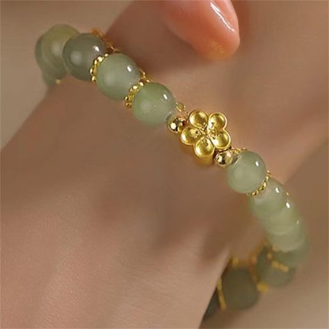 PRICES MAY VARY. ✅【2024 Hetian Jade Bracelet】The hetian jade gold Daisy bracelet is the means of holding back peace and keep happiness.Jade is a symbol of serenity and purity. It signifies gathered in tranquility.It increases love and nurturing.This jade bracelet can bring good luck and success to the wearer.Every piece is different in color and inside construction. ✅【Hetian Jade Elegant Bracelet】Hetian jade bracelet uses high-quality natural jade, exquisite workmanship, smooth surface, and comf Pretty Jewellery Bracelets, Alien Bracelet, Beads Candy, Daisy Bracelet, Flower Crystal, Hetian Jade, Crystal Beads Bracelet, Jade Bracelet, Elegant Bracelet