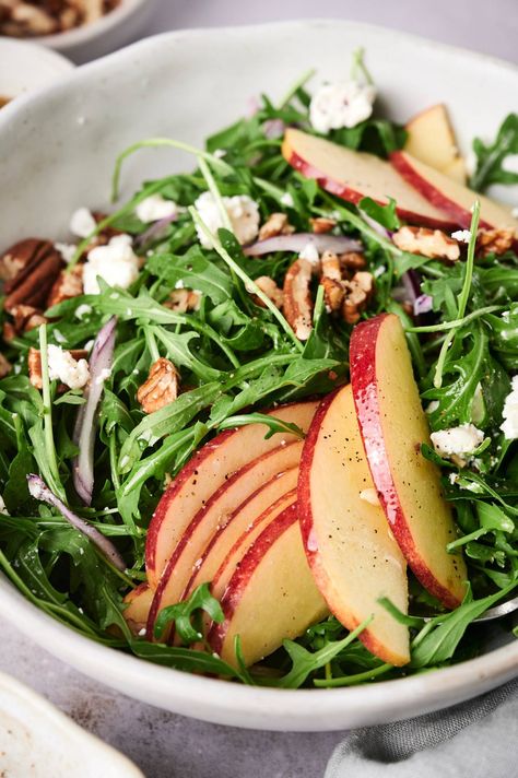 Looking for a fun and delicious salad to serve? This arugula, goat cheese, and apple salad with a lemon vinaigrette is the perfect side salad or main dish. #appetizer #salad #sidedish #quickandeasy Salad To Serve With Pasta, Arugula Apple Salad Recipes, Arugula Salad Recipes Goat Cheese, Arugula Salad With Feta Cheese, Arugula Salad Apple, Recipe With Arugula, Elegant Lunch Ideas, Simple Salad Recipe, Arugula Recipes Salad