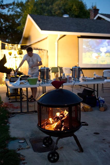 Halloween Driveway Party - hot dogs, smores, and a Halloween movie playing on a projector! Driveway Halloween Ideas, Driveway Party, Driveway Halloween Party, Driveway Party Ideas, Halloween Driveway Party, Halloween Driveway, Drive In Movie Backyard, Autumn Outdoor Movie Night, Projector Movie Night Fall