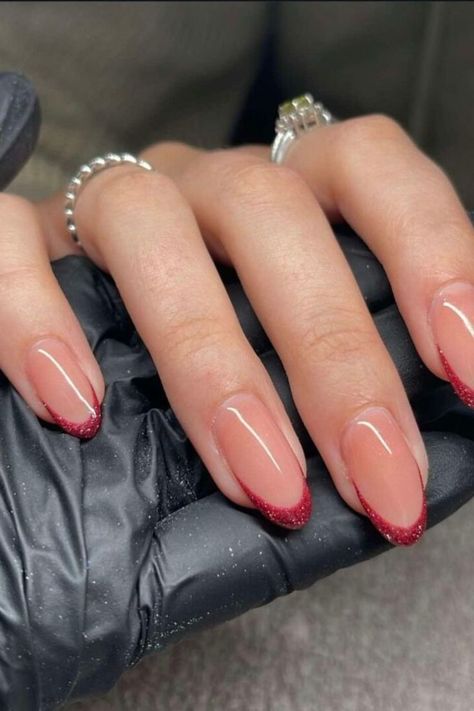 If you love the red color but prefer a more subtle look for your nails, this option is perfect for you. You can still add a touch of glamour by making them shiny.

These red shiny fall almond nails will help you blend in effortlessly no matter where you go or what time of day it is.//photocredit:@jxannnails Sparkly French Tip Nails, Sparkly French Tips, Fall Almond Nails, Engagement Nails, Red French, Cherry Nails, Almond Nails Designs, Upgrade Your Look, Beautiful Nail Designs