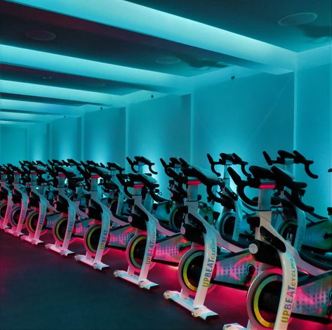 Cycling studio design experts Spin Studio Design Ideas, Cycling Studio Design, Futuristic Gym, Bike Room Design, Flywheel Design, Spinning Studio, Indoor Cycling Studio, Cycle Studio, Warehouse Gym