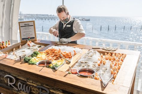 What could possibly make this scene more picturesque?! Our fresh Raw Bar consists of clams, crab claw lollipops, Shrimp, and most importantly - Freshly Shucked Oysters. Beautiful Bay scenes may or may not be included. #michaelseventcatering #catering #outdoorwedding #tentwedding #cheflife #serverlife #photooftheday #love Oyster Shucking Table, Oyster Display, Ceviche Bar, Wedding Food Bars, Wedding Food Display, Seafood Bar, Seafood Buffet, Shucking Oysters, Raw Bar