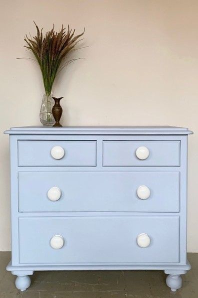 Small solid wood chest of drawers newly painted in Annie Sloan Chalk Paint in Louis Blue, finished with a clear wax. Four drawers, finished with vintage porcelain handles. The piece is elevated by its turned bun feet. Dimensions: Width: 87.0 cm, Height: 80.0 cm, Depth: 49.0 cm. Blue Chest Of Drawers, Antique Dressers, Louis Blue, Wood Chest Of Drawers, Painted Chest, Wood Chest, Annie Sloan Chalk Paint, Small Drawers, Annie Sloan