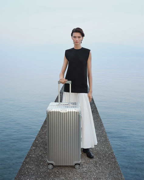 Nestled within the structured lines of Italy’s Villa La Scala, the RIMOWA Trunk Plus, constructed with tough, anodized aluminium, and the RIMOWA Lite Cabin, made from feather-light, impact-resistant polycarbonate, showcase their geometric craftsmanship in classic saturations, backed by a lifetime guarantee. #RIMOWA #RIMOWAOriginal #RIMOWAEssential Rimowa Trunk Plus, Rimowa Trunk, Rimowa Luggage, Emerald Colour, Checked Luggage, Soho Nyc, Hand Luggage, Ways To Travel, Feather Light