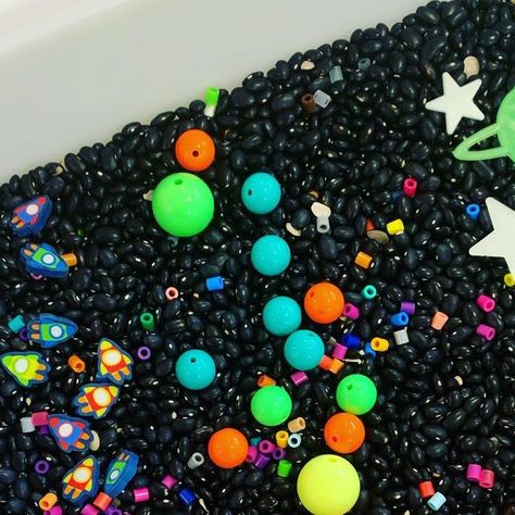 Sicklerville Preschool on Instagram: "Space Sensory Bin! Items used: black beans, perler beads, beads, spray painting rocks, mini erasers, and glow in the dark stars  . . . . . #sensorybin #sensorybins #sensoryplay #sensoryplayideas #spacesensorybin #preschoolspacetheme #preschoolathome #space #homedaycare #daycareowner #familychildcare" Space Sensory Bin, Space Sensory, Home Day Care, Glow In The Dark Stars, Mini Erasers, Dark Stars, Family Child Care, Painting Rocks, Sensory Bin