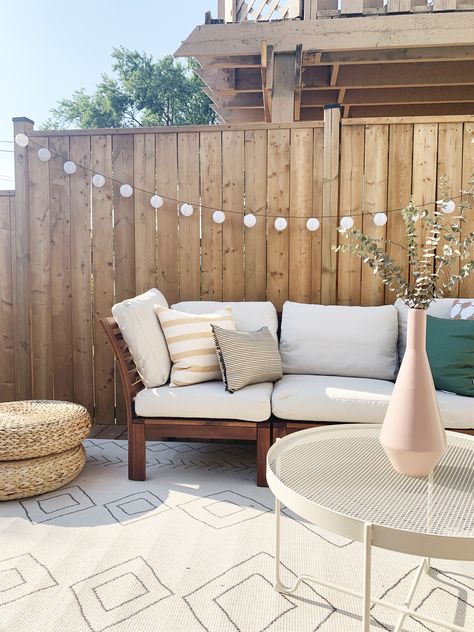 I made over a beautiful patio from start to finish! I hope this gives you inspiration to makeover your own patio. I've also thrown in some DIY Ikea outdoor furniture hacks! We've all got outdoor Ikea furniture, so I've included some simple ways to jazz it up!  #patiomakeover #outdoorikeahacks #backyardmakeover #backyarddecor #outdoordecor #outdoordecoratingideas #patiodecorideas #bestikeahacks #tasselumbrella #ikealanterns #ikeaoutdoordecor #bohopatio #bohobackyard Ikea Lounge Outdoor, Ikea Yard Ideas, Frösön Ikea, Ikea Terrace Ideas, Ikea Applaro Hack, Ikea Patio Hacks, Ikea Outdoor Furniture Hacks, Ikea Nämmarö Ideas, Ikea Patio Ideas