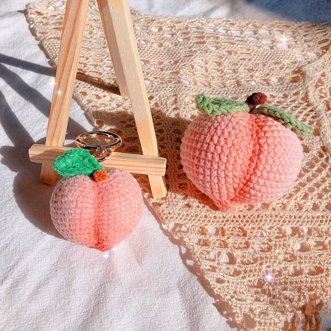 Crochet a cute peach amigurumi pattern that can be used as a keychain, bag ornament, or Crochet Peach Pattern Free, Crochet Peach, Peaches And Creme Crochet Patterns, Peach Pouch Crochet, Crochet Fruit Keychain, Peach Crochet Keychain, Beginner Crochet Tutorial, Crochet World, Crochet Toys Patterns