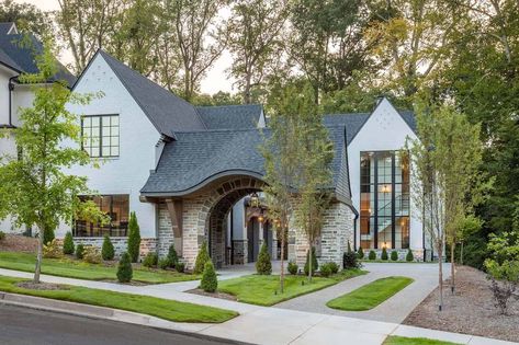 English Tudor style home with a beautiful modern twist in South Carolina Tudor Style Barndominium, Modern Tudor Interior Design, Modern French Tudor, Tudor Style Homes Plans, Modern Tudor House Exterior, Beach House Getaway, English Tudor Homes, Modern Tudor, Contemporary Mediterranean