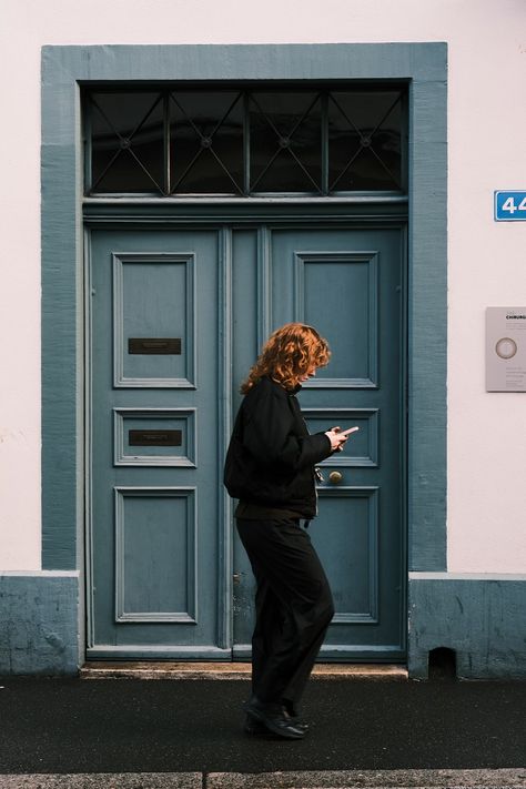 A woman standing in front of a blue door photo – Free Street photography Image on Unsplash Front Door Photo Shoot, Tfp Photoshoot, Doorway Photography, Door Photoshoot, Retro Shoot, London In January, People Street, Door Picture, Picture Tree