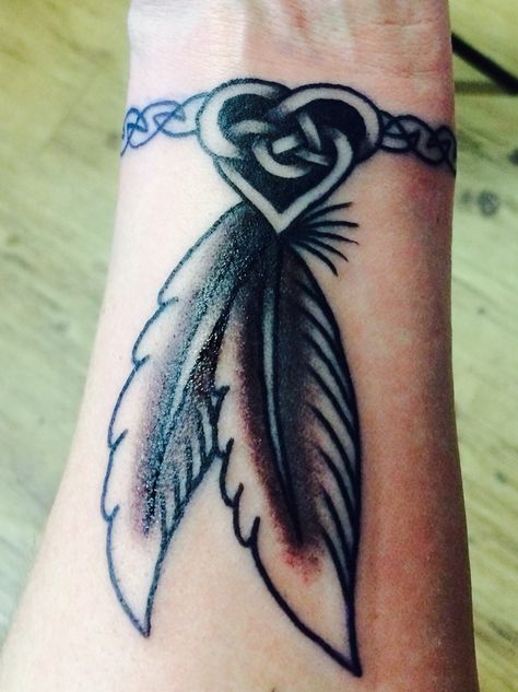 Celtic heart and band to honor the Scotts-Irish, I get from my mom's side and feathers to honor the Native American, I get from my dad's side. #tattoo #celticheart #feathers Anklet Tattoo Design, Feather Hip Tattoos, Feather Tattoo Ideas, Cherokee Tattoos, Feathers Tattoo, Anklet Tattoo, Indian Feather Tattoos, Native Tattoos, Hand Tattoos For Girls