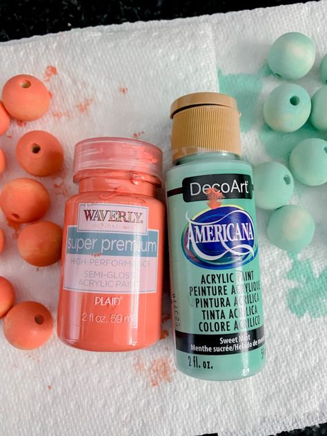 Painted wood bead hack Painted Wood Bead Garland Diy, Easy Way To Paint Wooden Beads, Painting Wooden Beads Diy, Wood Bead Keychains, Painting Beads Wooden, How To Paint Wood Beads, How To Dye Wood Beads, Wooden Bead Crafts Diy, How To Paint Wooden Beads