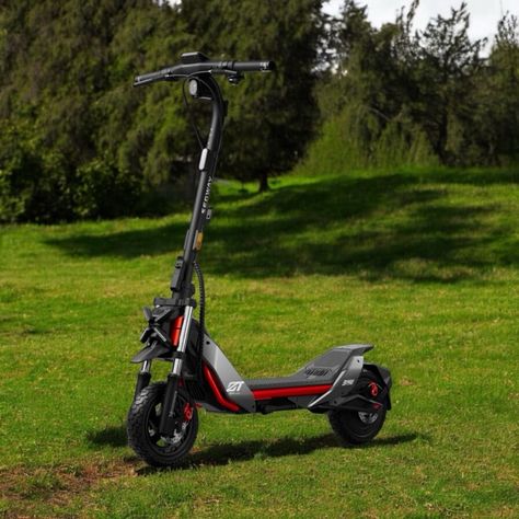 A Segway ZT3 Pro electric scooter on full display within a grassy meadow. New Story, Mopeds, Electric Scooter, Tech News, Scooters, Transportation, Motorcycles, Electricity