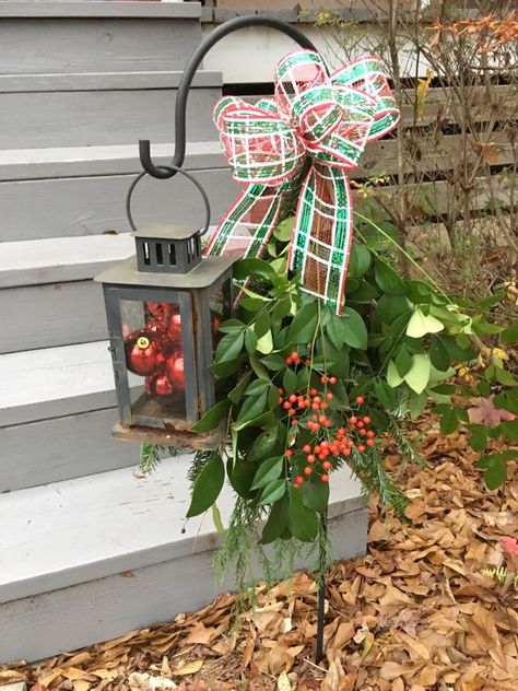 Small shepherd's hook with lantern Winter Shepherds Hook Ideas, Shepherd Hook Christmas Decorations, Christmas Shepherd Hooks, Christmas Outdoor Decorations Shepherds Hook, Shepherds Hook In Planter, Shepard Hook Christmas Decor, Small Shepherd Hook Ideas, Fall Shepards Hook Ideas, Shepherds Hook Christmas Decor