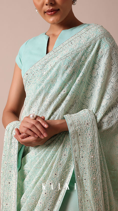 Create a look of effortless elegance with this timeless blue-hued saree. Crafted from georgette fabric, it is detailed with all over glimmering sequin embellishments. Flaunting meticulous artistry and traditional Lucknowi chikankari work, it is paired with an unstitched blouse piece. Chikankari Blouse Designs, White Chikankari Kurta, Lucknowi Saree, Chikankari Blouse, Deep Red Lip, Yellow Bride, Brown Extensions, Lucknowi Chikankari Saree, Yellow White Flowers