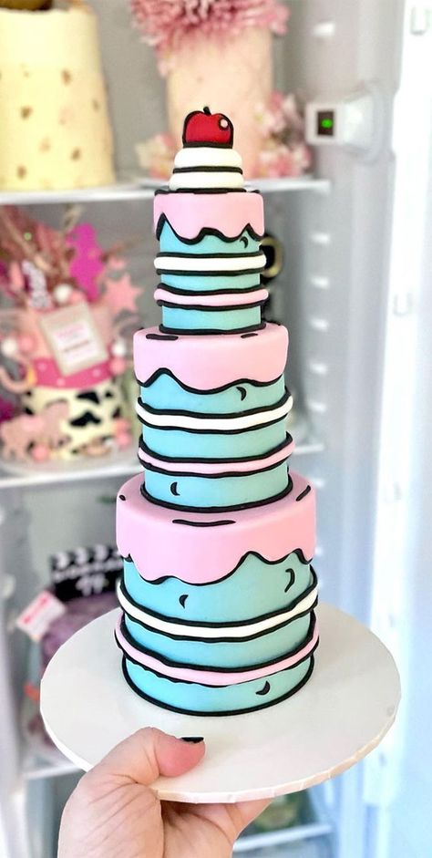 30+ Cute Comic Cakes For Cartoon Lovers : Blue and Pink Three-Tired Cake Comics Cake Ideas, Cake Trends For 2023, New Trend Cake Design, Cartoon Cake Ideas, Carton Cake, Comic Book Cake, Cartoon Cake Design, Awesome Birthday Cakes, Comic Cake