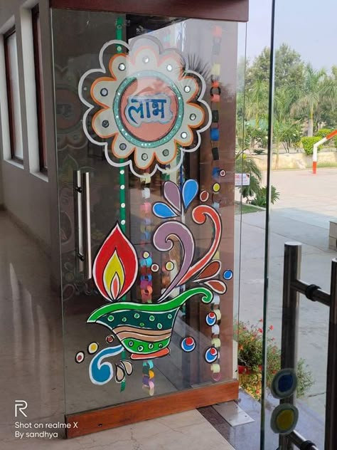 Glass painting on diwali Diwali Decorations At School Wall, Diwali Glass Decorations, Diwali Glass Painting Ideas, Diwali Door Decoration Ideas For School, Glass Door Decoration For School, Diwali Glass Painting, Diwali Classroom Decoration, Diwali Display Board Ideas, Diwali Bulletin Board Ideas