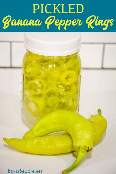 Learn how to can banana pepper rings with this easy refrigerator pickled peppers recipe that is made with your mild or hot banana peppers plus salt, sugar, vinegar, and water. #Pickled #Garden #Canning #Vegetables #Peppers Jarred Banana Pepper Recipe, How To Can Banana Peppers Easy, Mild Pepper Rings Recipe, How To Make Banana Pepper Rings, Refrigerator Banana Peppers Recipe, Banana Pepper Rings Canning, Mild Banana Pepper Recipes, Easy Pickled Banana Peppers Recipe, Pickled Hot Banana Peppers Recipe