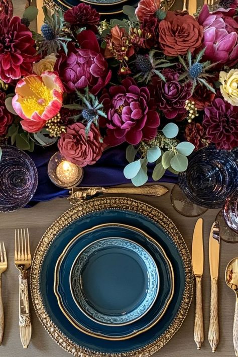 Embrace bold jewel tones for a vibrant and unique Thanksgiving color scheme. #ThanksgivingColors #BoldDecor #JewelTones Jewel Tone Flowers Centerpiece, Jewel Tones Birthday Party, Jewel Tones Table Setting, Royal Color Palette Jewel Tones, Jewel Toned Wedding Decor, Jewel Themed Party, Jewel Tone Birthday Party, Jewel Tone Tablescape, Jewel Tone Wedding Centerpieces